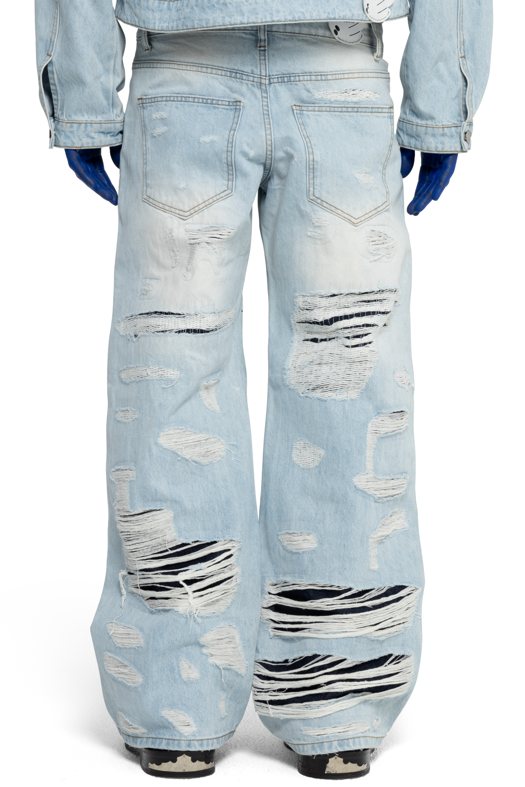 DISTRESSED DOUBLE DENIM PANTS